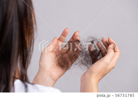 Healthy concept. Woman show her damaged long hair Healthy concept. Woman show her damaged long hair 56731785