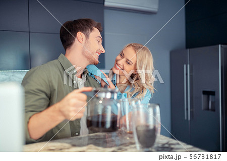 Couple smiling while enjoying morning at home together 56731817
