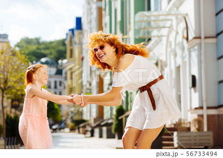 Positive delighted mom and kid having fun together 56733494