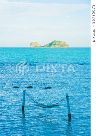 Empty hammock around beautiful beach sea ocean for relax in holiday vacation 56735075