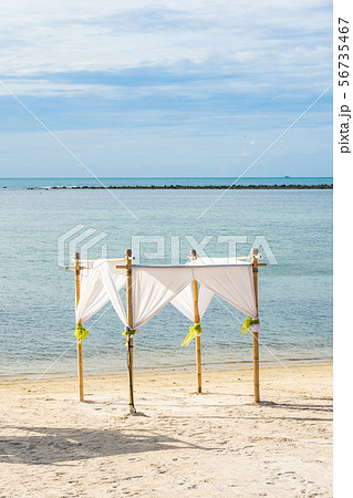 Beautiful outdoor tropical beach sea ocean with umbrella chair and lounge deck around there on white cloud blue sky Beautiful outdoor tropical beach sea ocean with umbrella chair and lounge deck around there on white cloud blue sky 56735467