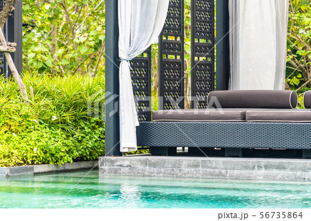 Beautiful outdoor swimming pool in hotel and resort with chair and deck for leisure vacation 56735864