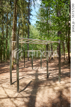 Pull up bars in a forest, outdoor gym equipment Pull up bars in a forest, outdoor gym equipment 56737290