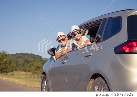 Happy father and son sitting in the car at the day 56737925