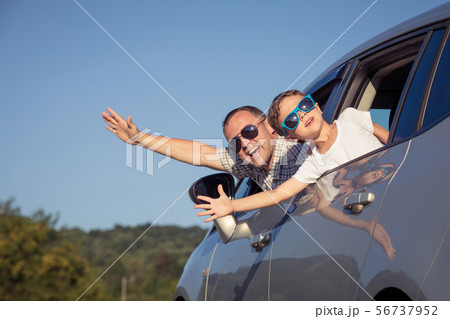 Happy father and son sitting in the car at the day 56737952