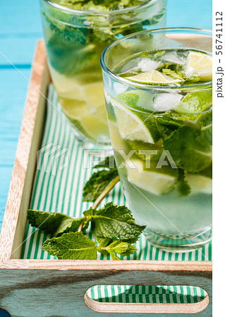 Two glasses of mojito in wooden box with mint 56741112