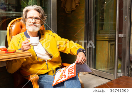 Man drinking his morning coffee thiking over stroll. Man drinking his morning coffee thiking over stroll. 56741509