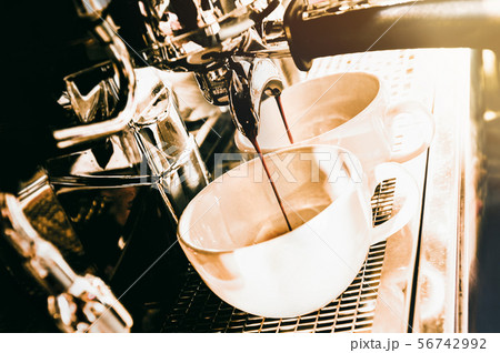 Espresso machine brewing a coffee. Coffee pouring Espresso machine brewing a coffee. Coffee pouring 56742992