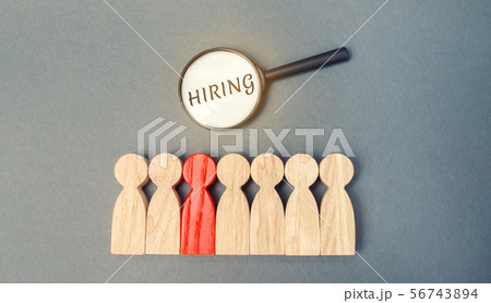 Magnifying glass with the word Hiring  56743894