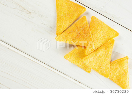 Tortilla cheese chips on grey wood 56750289