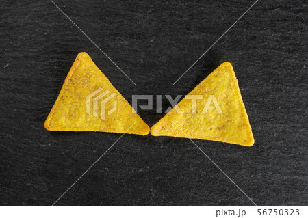 Tortilla cheese chips on grey stone 56750323