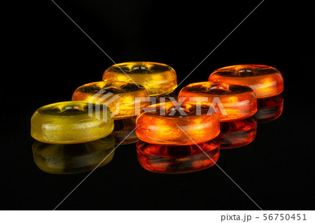 Colourful hard candy isolated on black glass 56750451