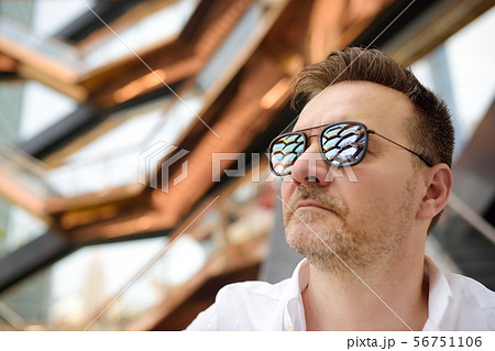 Man with sunglasses on the background of Vessel  56751106