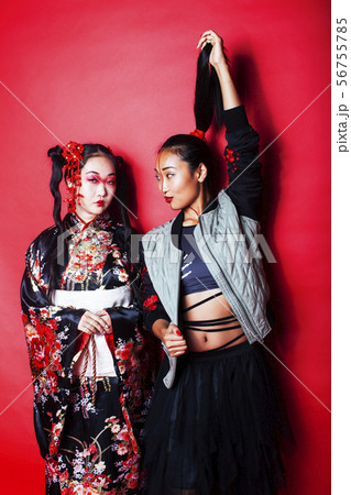 two pretty geisha girls friends modern asianの写真素材
