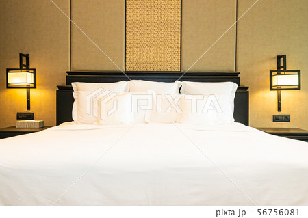 Beautiful luxury comfortable white pillow on bed decoration in bedroom 56756081