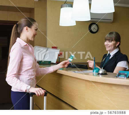 Hostess and guest communicate with each other 56763988