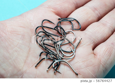 fishing hooks hold in the palm of the open fishing hooks hold in the palm of the open 56764427