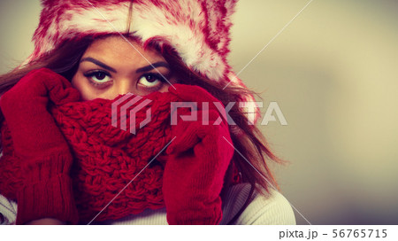 Woman with red winter clothing. 56765715
