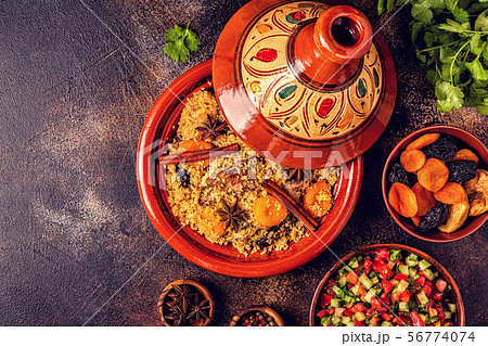 Traditional moroccan tajine of chicken with dried 56774074