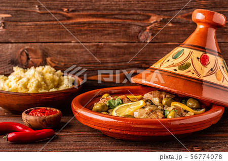 Traditional Moroccan chicken tagine with olives Traditional Moroccan chicken tagine with olives 56774078