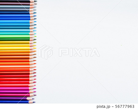 Horizontal row of colorful pencils on white 56777963
