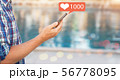 Male hand holds a smart phone. 56778095