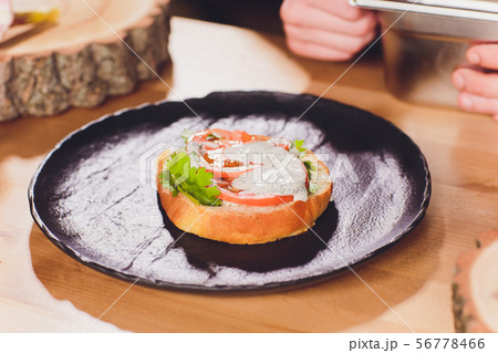 Chef making healthy vegetarian salmon burgers outdoor on open kitchen, odprta kuhna, international Chef making healthy vegetarian salmon burgers outdoor on open kitchen, odprta kuhna, international 56778466