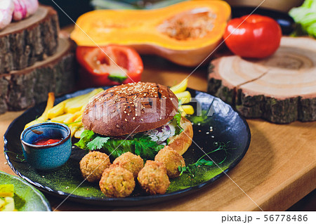 Red, green,black mini burgers with quinoa and vegetables. 56778486