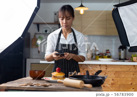 photographer food , asian women is taking pictures photographer food , asian women is taking pictures 56783900