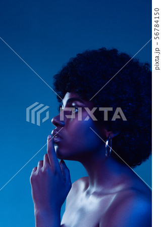 Portrait of female high fashion model in neon light 56784150