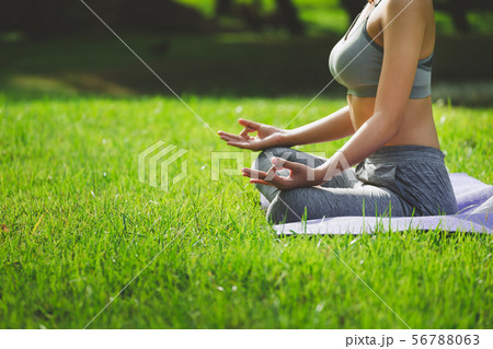 Fitness asian woman doing yoga in park 56788063