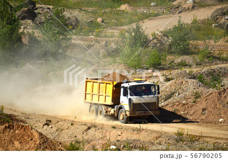 Dump truck transporting sand in mining quarry Dump truck transporting sand in mining quarry 56790205