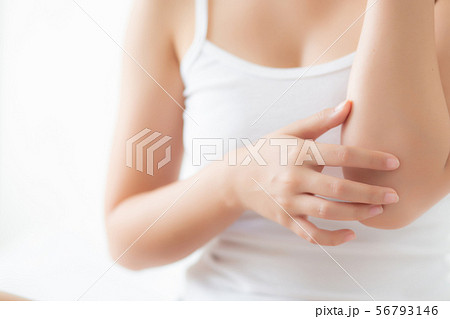 Closeup elbow beautiful asian woman applying cream Closeup elbow beautiful asian woman applying cream 56793146