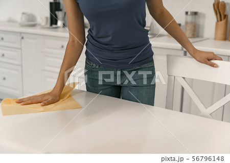 Housewife washing kitchen table with cloth stock photo Housewife washing kitchen table with cloth stock photo 56796148