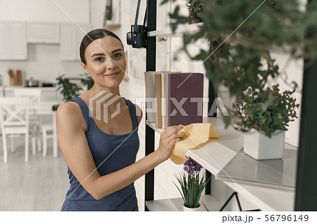 Delighted woman during housekeeping at home stock photo Delighted woman during housekeeping at home stock photo 56796149