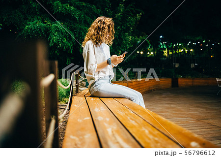 Unrecognizable young woman wearing white shirt Unrecognizable young woman wearing white shirt 56796612