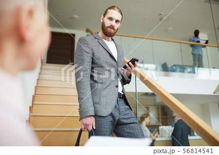 Succesfsul Businessman Going Downstairs Succesfsul Businessman Going Downstairs 56814541