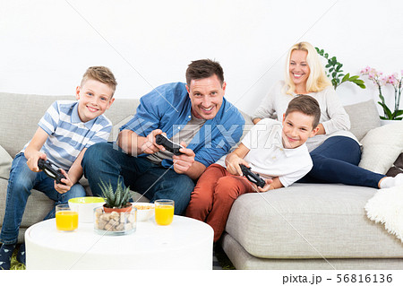 Teenager playing video games at home - Stock Photo - Masterfile - Premium  Royalty-Free, Code: 614-07768268