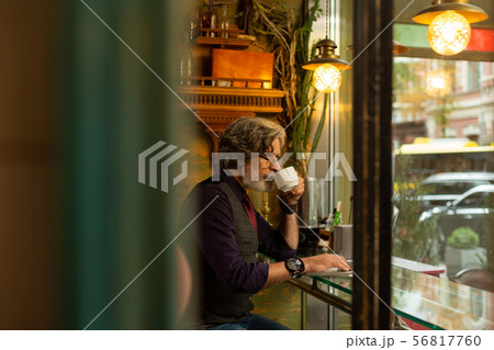Man drinking coffee and thinking of work. Man drinking coffee and thinking of work. 56817760