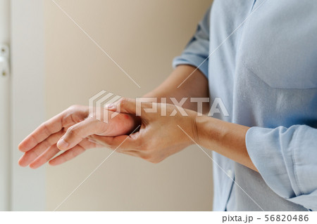 woman wrist arm pain long working. office syndrome 56820486
