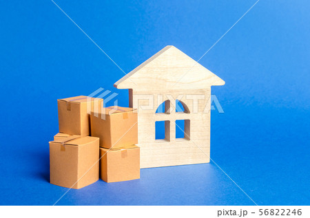 Living house and pile of boxes. Concept of moving Living house and pile of boxes. Concept of moving 56822246