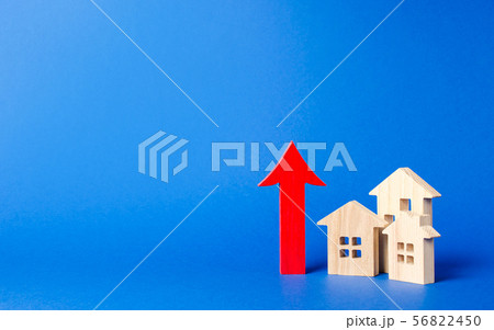 three wooden houses and red up arrow. High rates three wooden houses and red up arrow. High rates 56822450