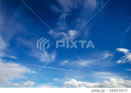 white fluffy clouds in the blue sky 56823072