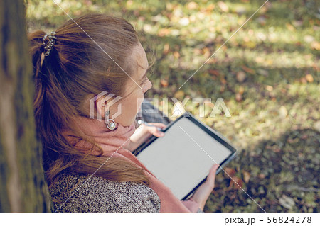 Real businesswoman with tablet laptop at work Real businesswoman with tablet laptop at work 56824278
