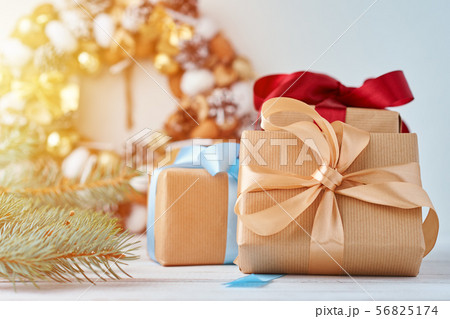 Christmas gift box with ribbon and decorations 56825174