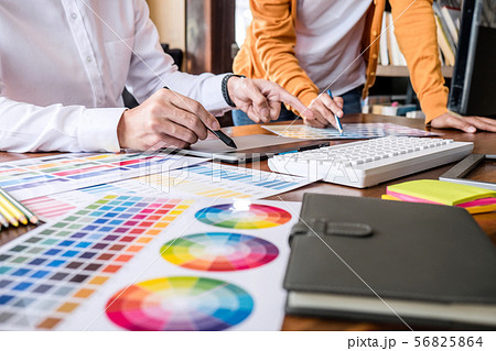 Two colleagues creative graphic designer working 56825864