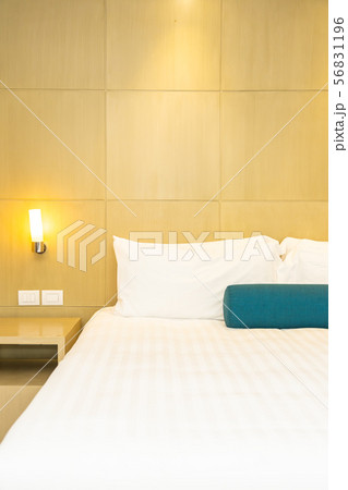 Beautiful white pillow and blanket on bed decoration interior Beautiful white pillow and blanket on bed decoration interior 56831196