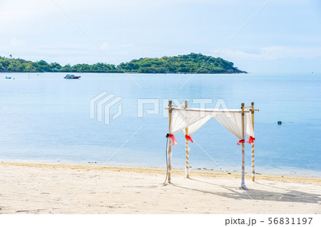 Beautiful outdoor tropical beach sea ocean with umbrella chair and lounge deck around there on white cloud blue sky 56831197