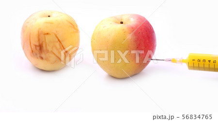 Apple and syringes isolated 56834765