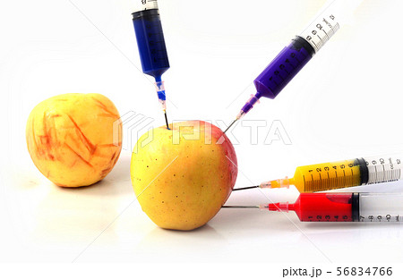 Apple and syringes isolated 56834766